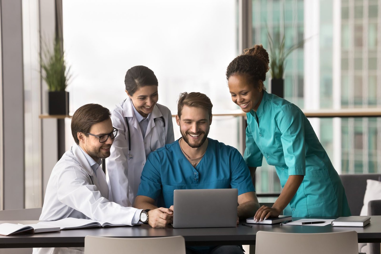 Clinical and administrative staff reviewing performance